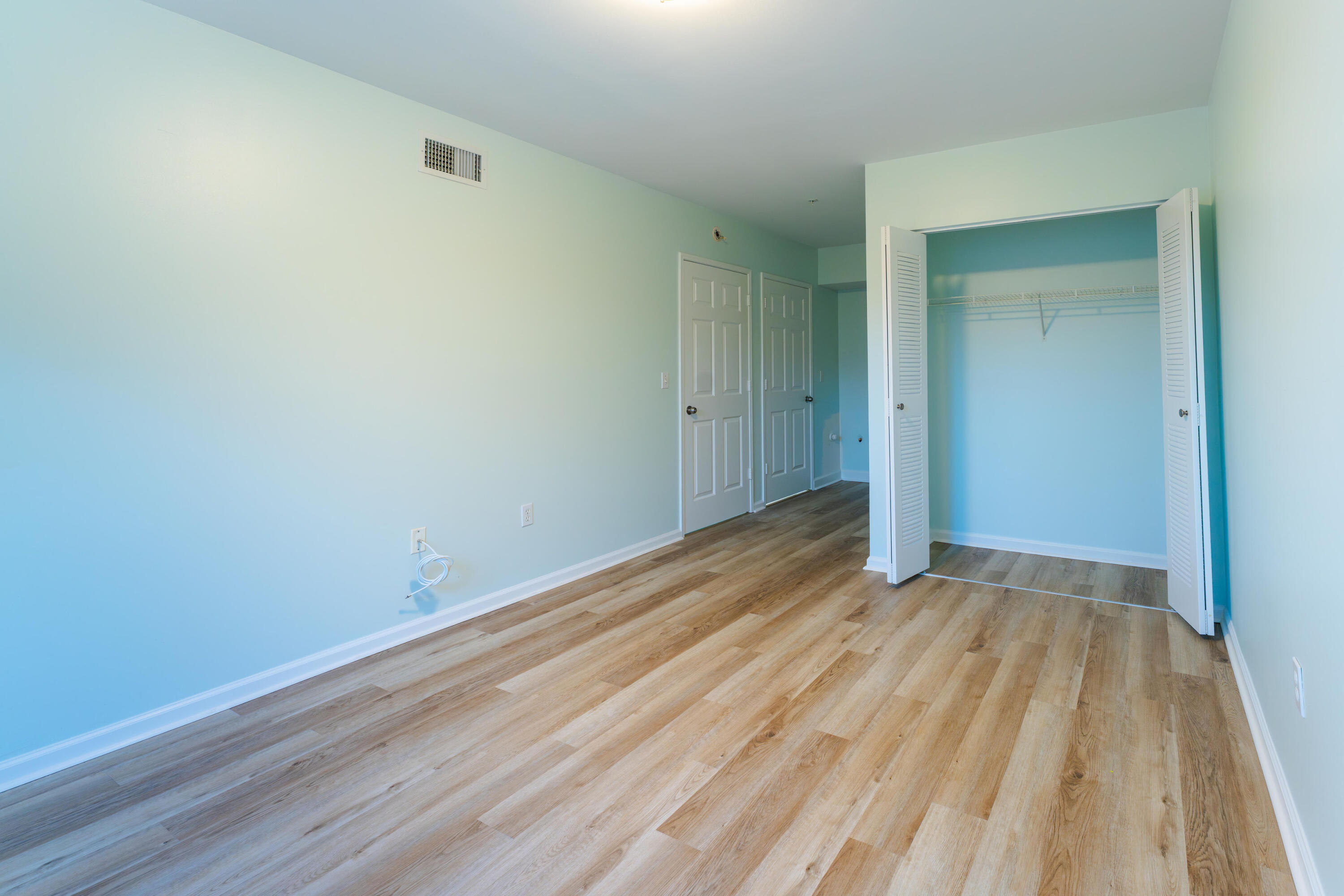 236 Village Boulevard, Unit 1304 Tequesta, FL 33469 - Photo 7 of 30 a view of a room with wooden floor