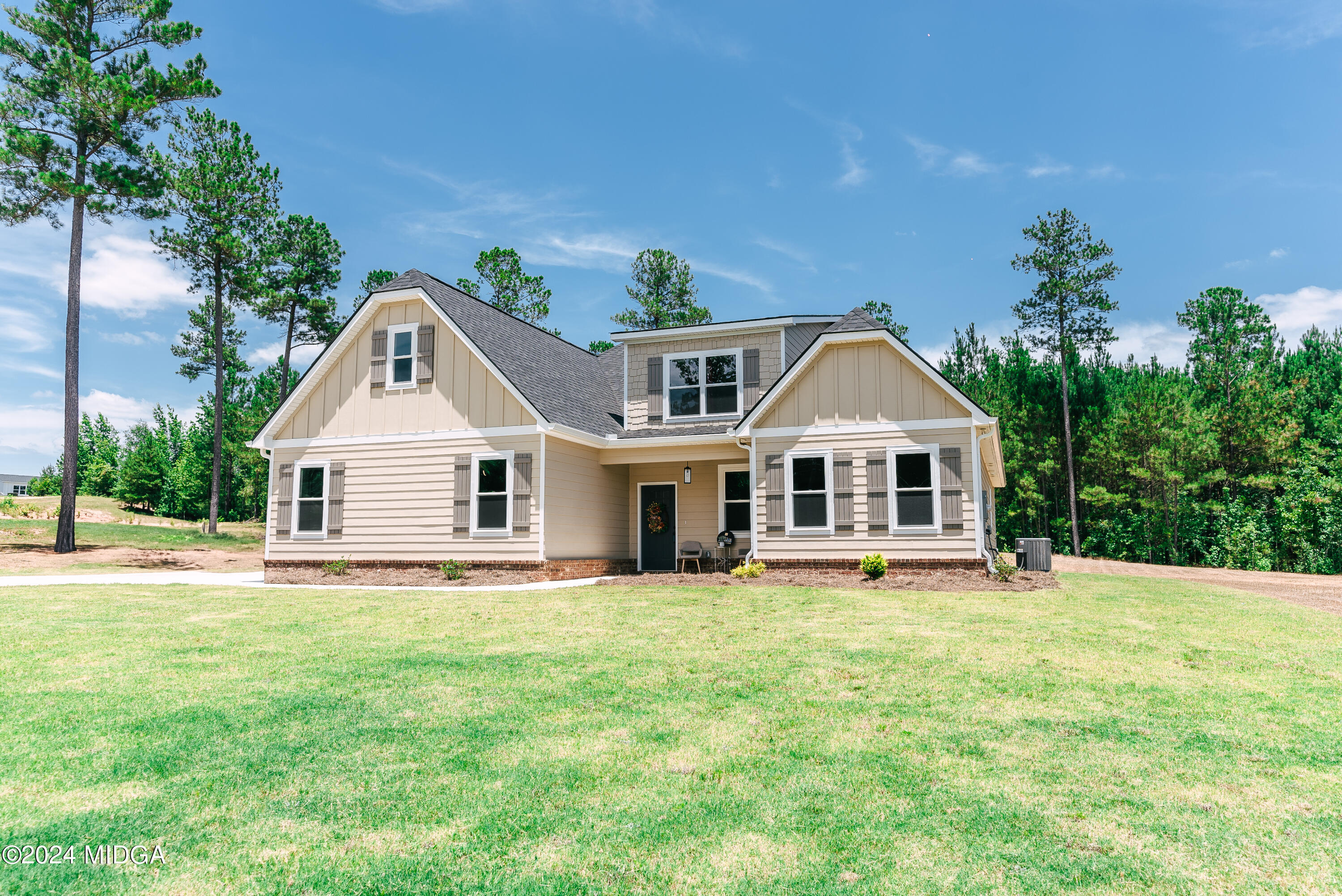1190 Josey Road Forsyth, GA 31029 - Photo 1 of 25 a front view of a house with a yard