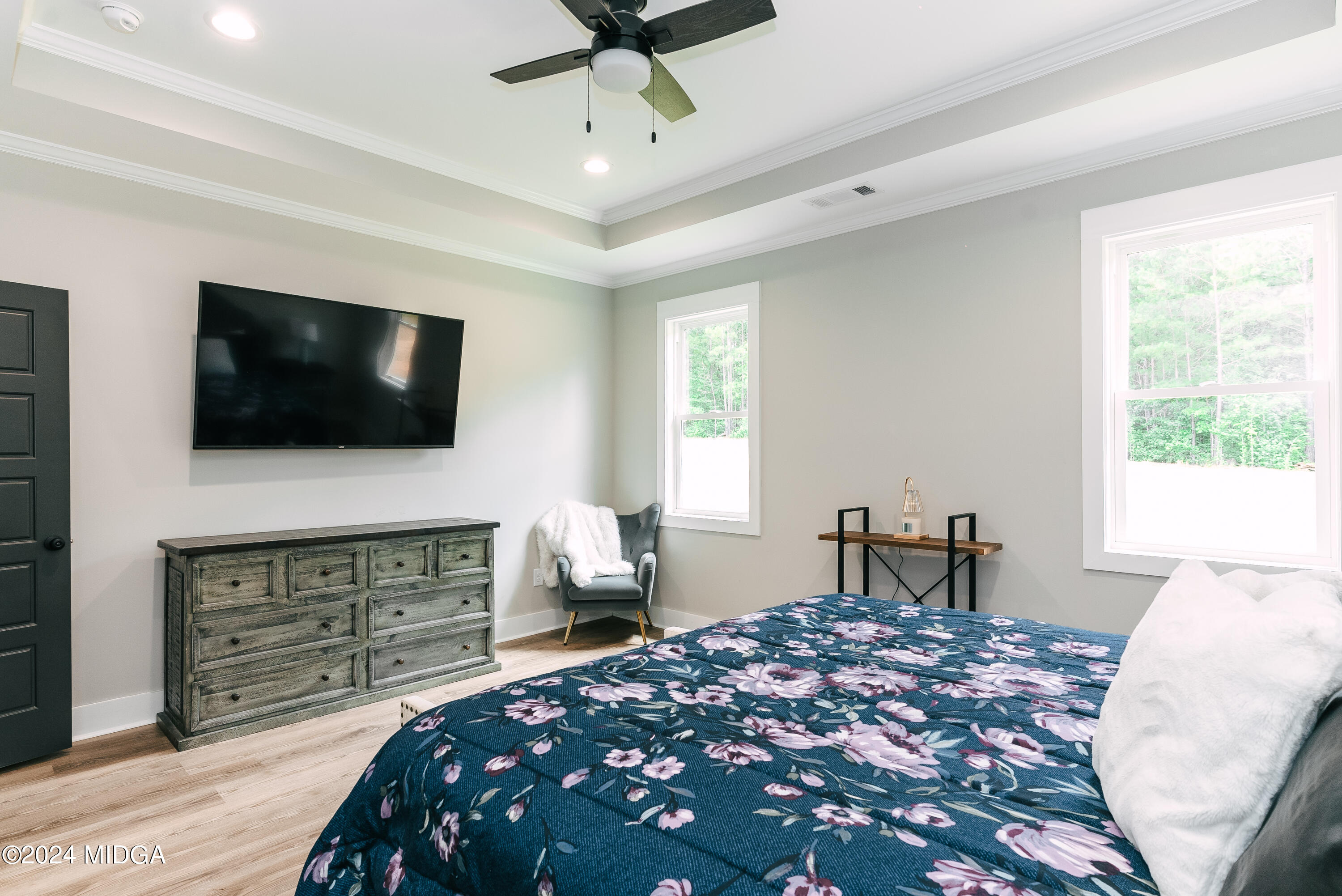 1190 Josey Road Forsyth, GA 31029 - Photo 15 of 25 a bedroom with a bed and a flat screen tv