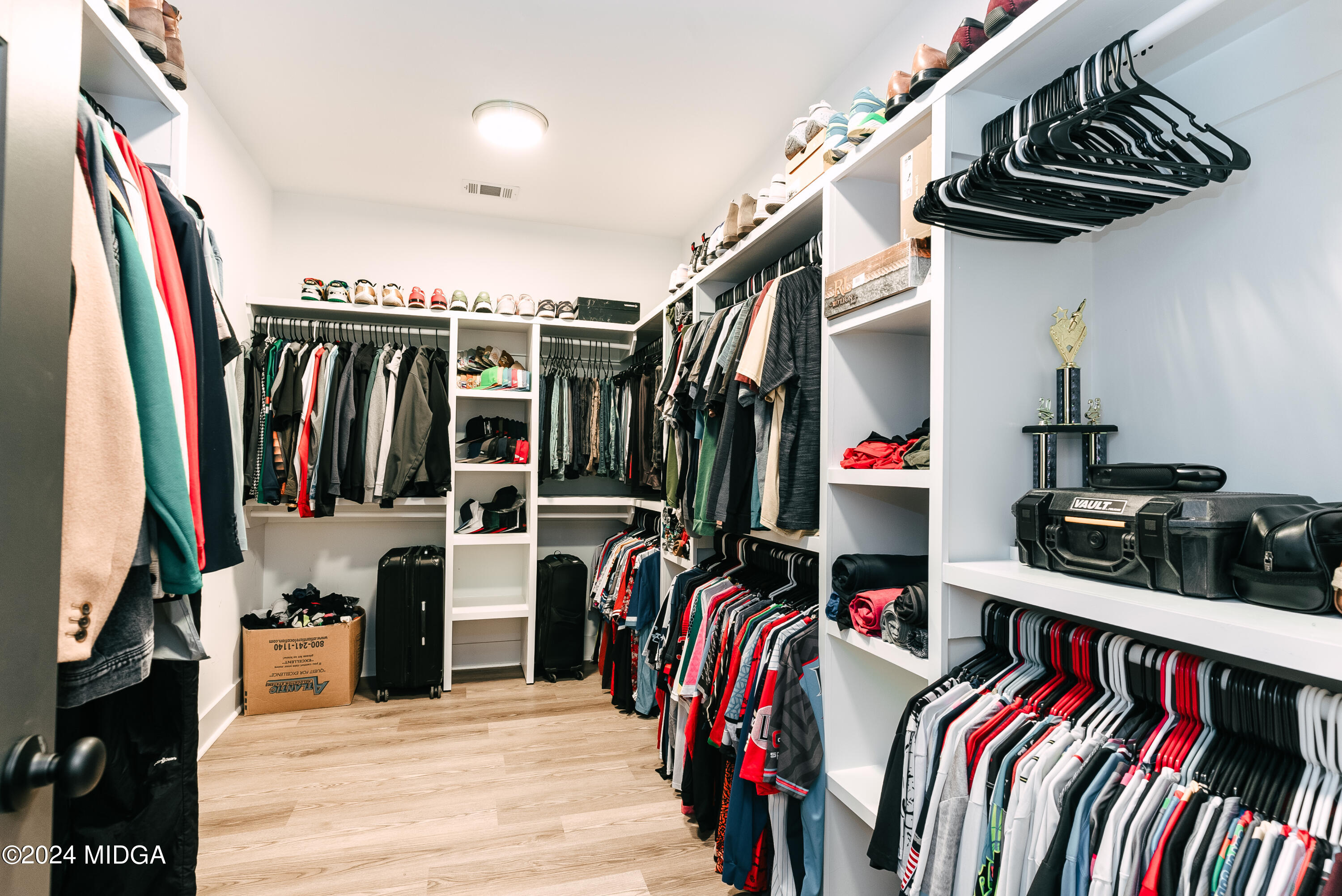 1190 Josey Road Forsyth, GA 31029 - Photo 18 of 25 a view of walk in closet with clothes and shoes
