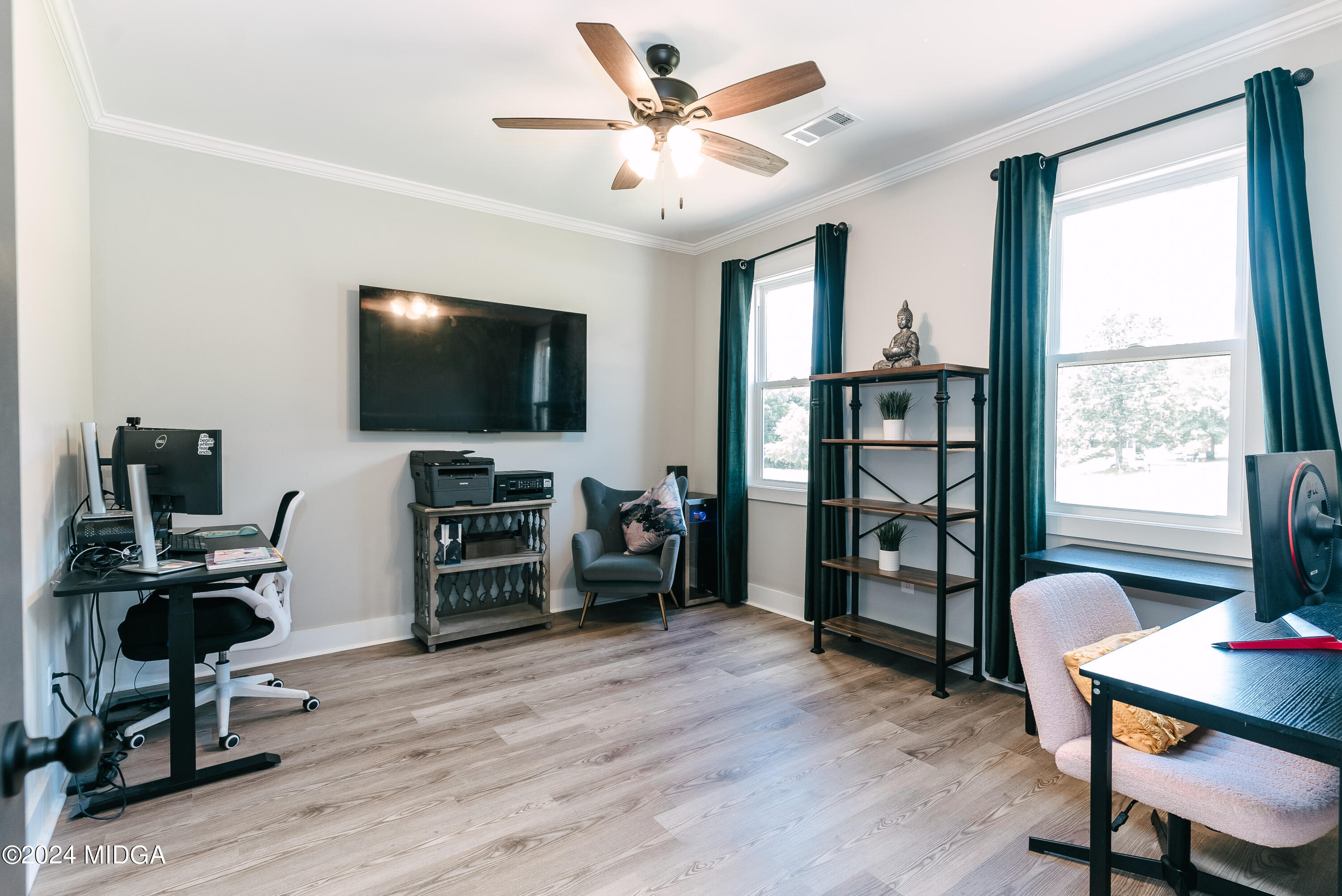 1190 Josey Road Forsyth, GA 31029 - Photo 22 of 25 a living room with furniture and a flat screen tv