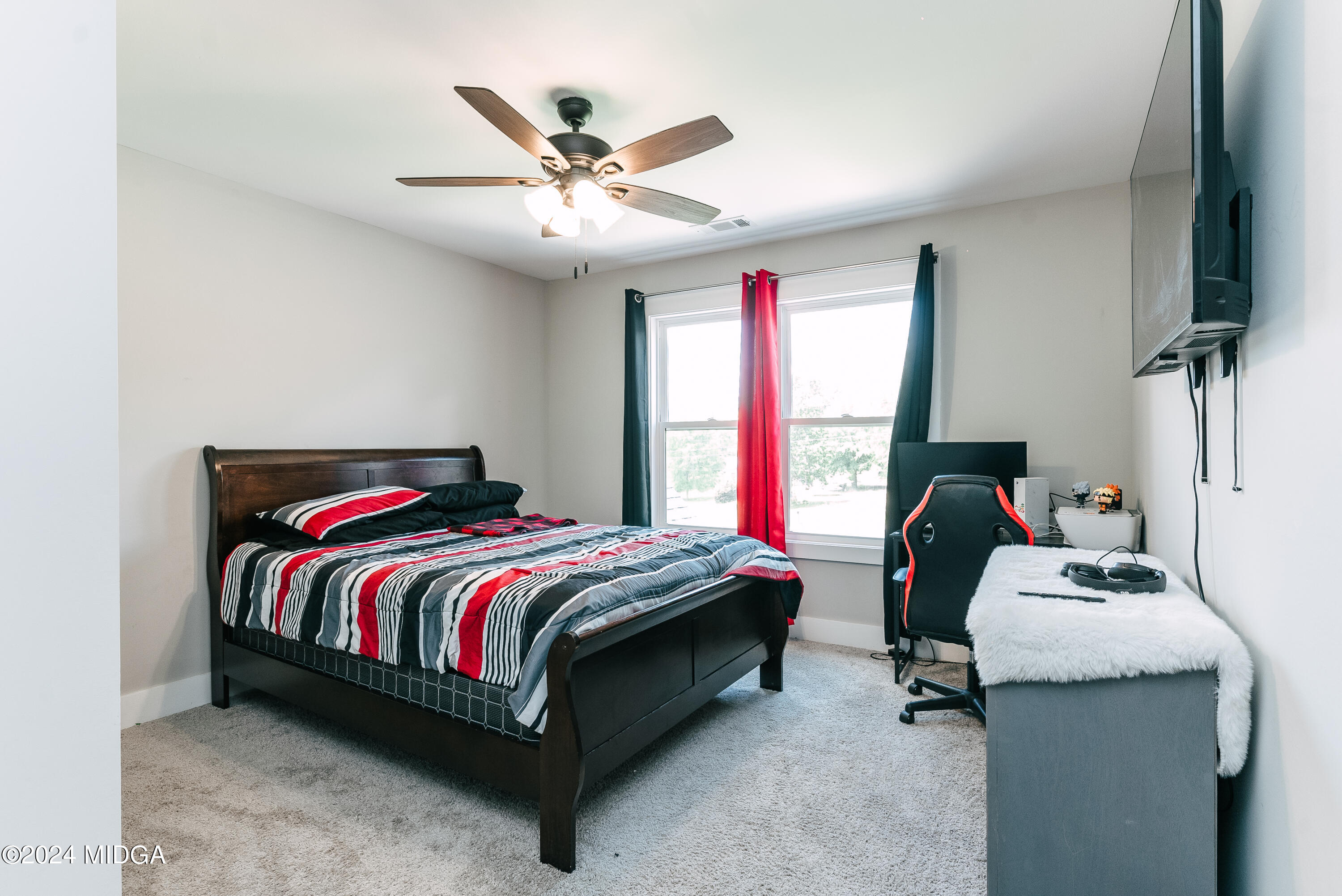 1190 Josey Road Forsyth, GA 31029 - Photo 23 of 25 a bed room with a bed and a window