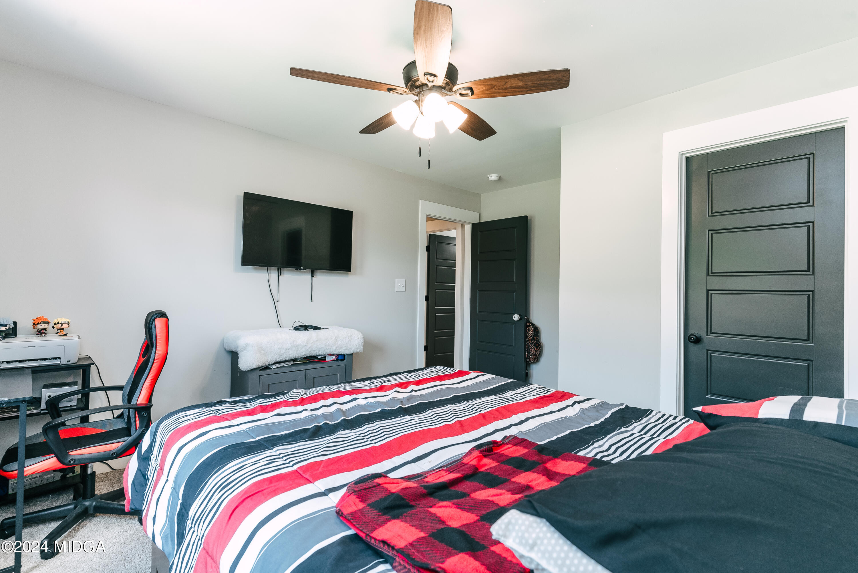 1190 Josey Road Forsyth, GA 31029 - Photo 24 of 25 a bedroom with bed and a large mirror