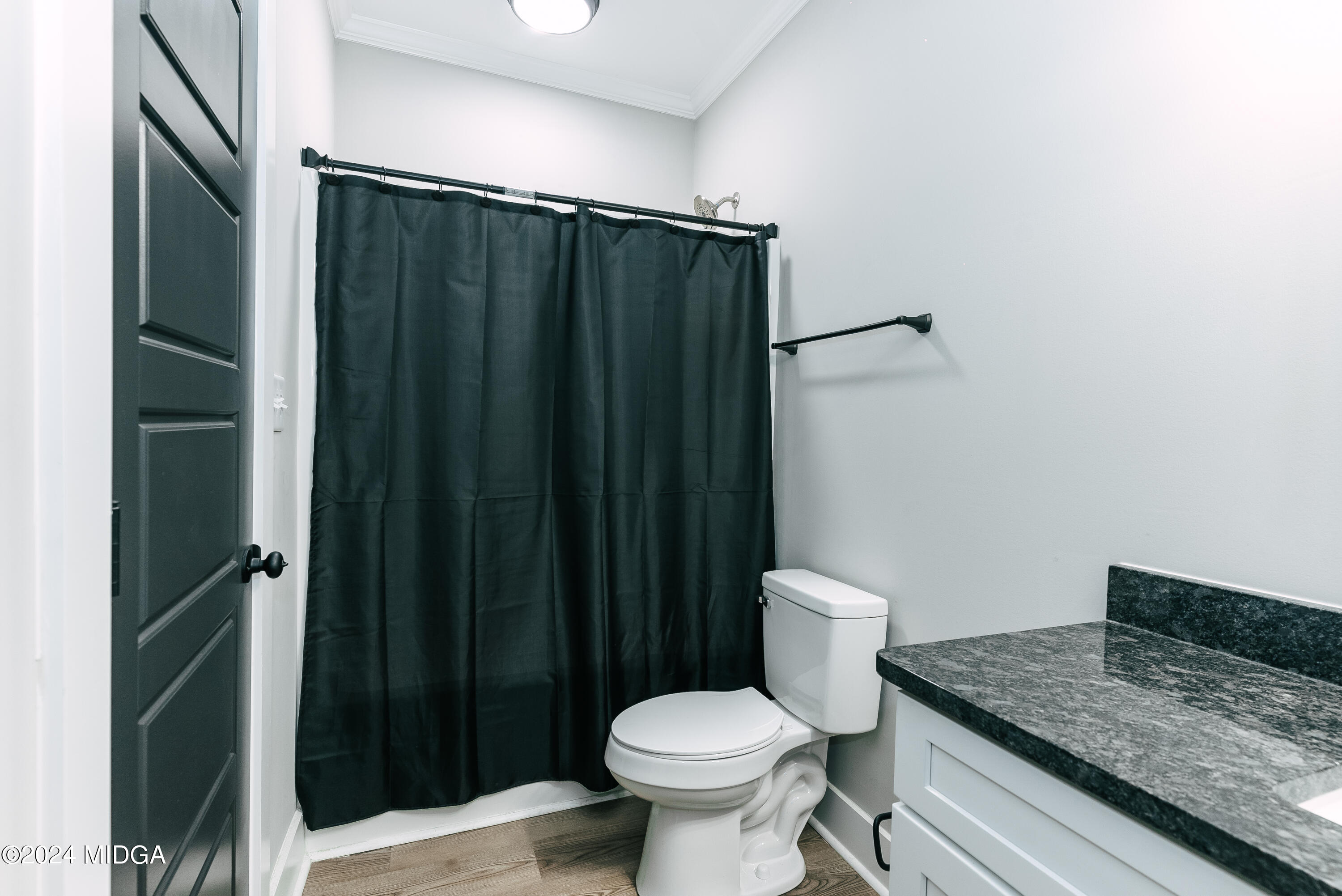 1190 Josey Road Forsyth, GA 31029 - Photo 25 of 25 a bathroom with a granite countertop toilet and a sink