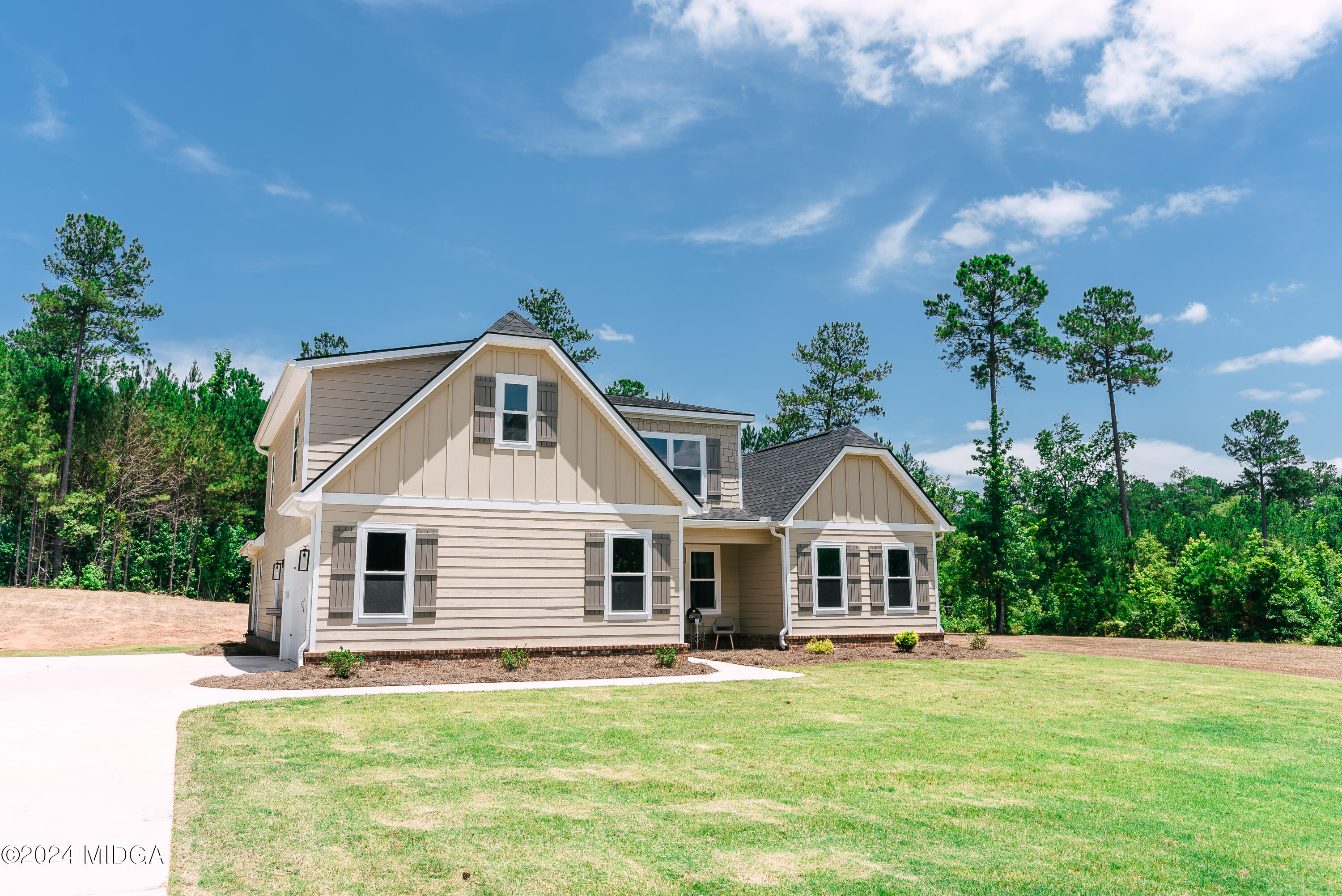 1190 Josey Road Forsyth, GA 31029 - Photo 3 of 25 a front view of a house with a yard