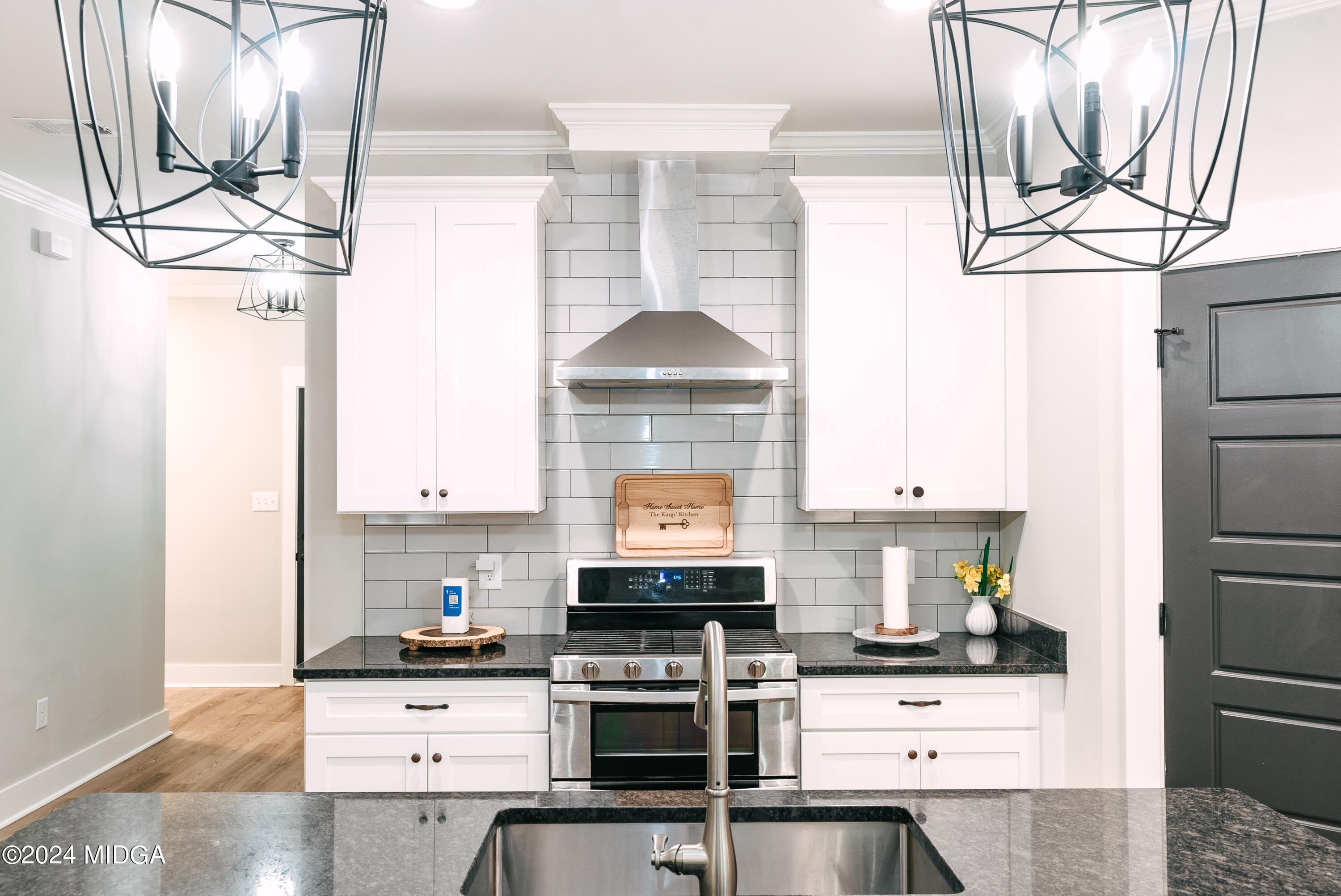 1190 Josey Road Forsyth, GA 31029 - Photo 7 of 25 a kitchen with stainless steel appliances a stove and more cabinets