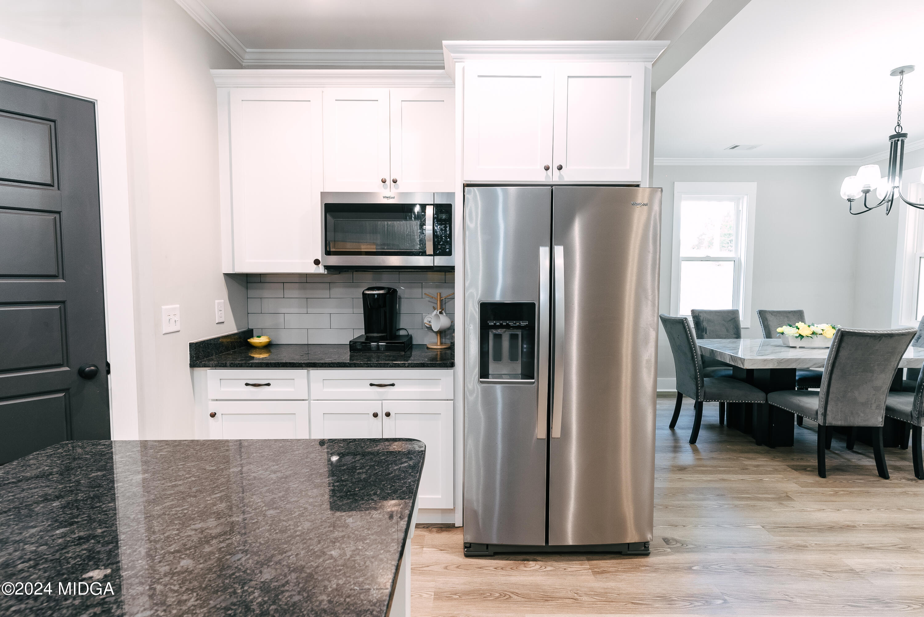 1190 Josey Road Forsyth, GA 31029 - Photo 8 of 25 a kitchen with stainless steel appliances a refrigerator stove microwave and cabinets