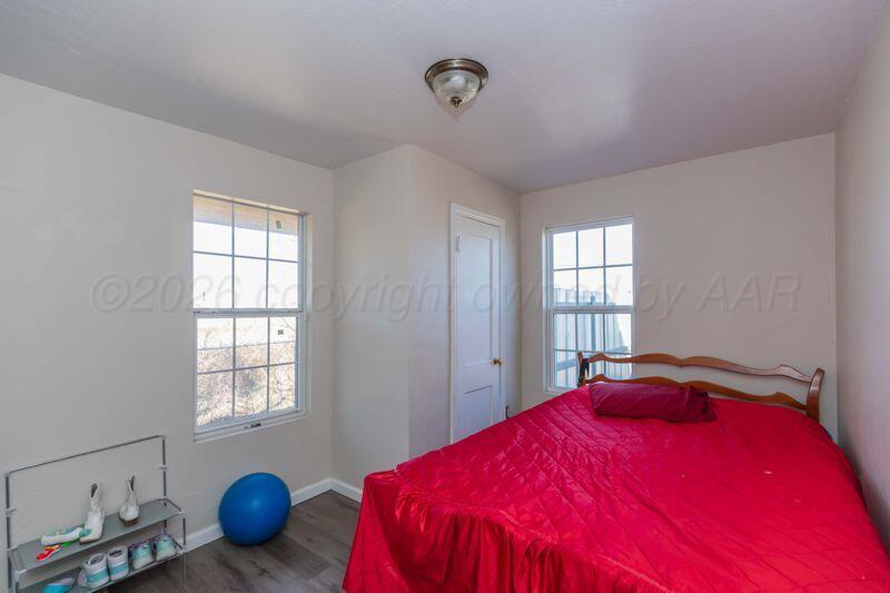 2106 Southwest 1st Avenue Amarillo, TX 79106 - Photo 12 of 17 a bedroom with a bed and window