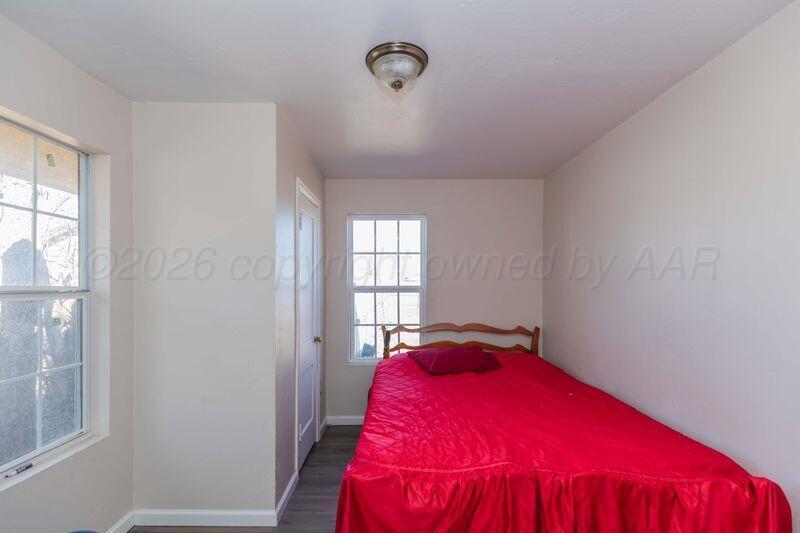 2106 Southwest 1st Avenue Amarillo, TX 79106 - Photo 13 of 17 a view of a bedroom with a bed and a window