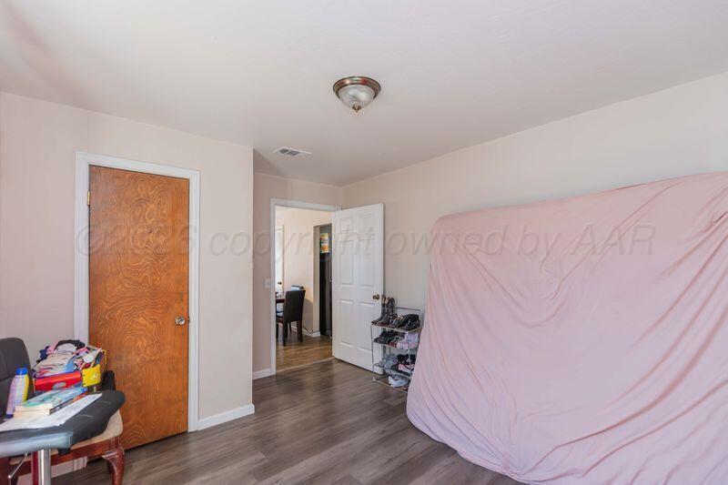 2106 Southwest 1st Avenue Amarillo, TX 79106 - Photo 15 of 17 a view of a livingroom with wooden floor and a hallway