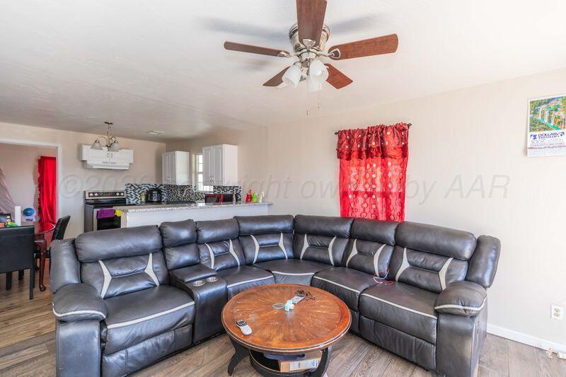 2106 Southwest 1st Avenue Amarillo, TX 79106 - Photo 6 of 17 a living room with furniture a rug and a window