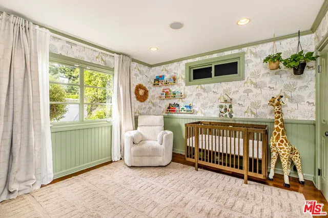 a bedroom with furniture and a window