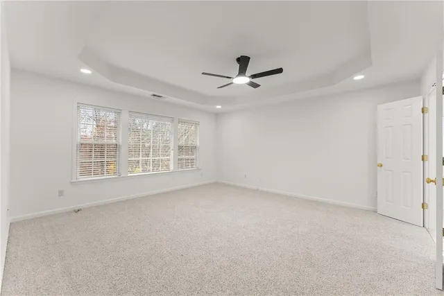 an empty room with a empty space and windows