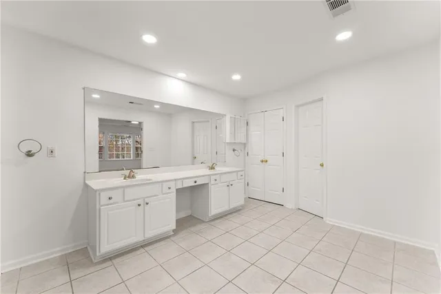 a kitchen with granite countertop cabinets and appliances