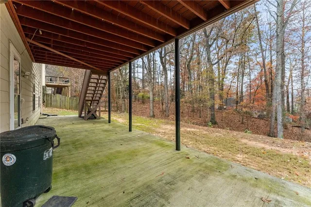 an aerial view of a house with swimming pool and outdoor space