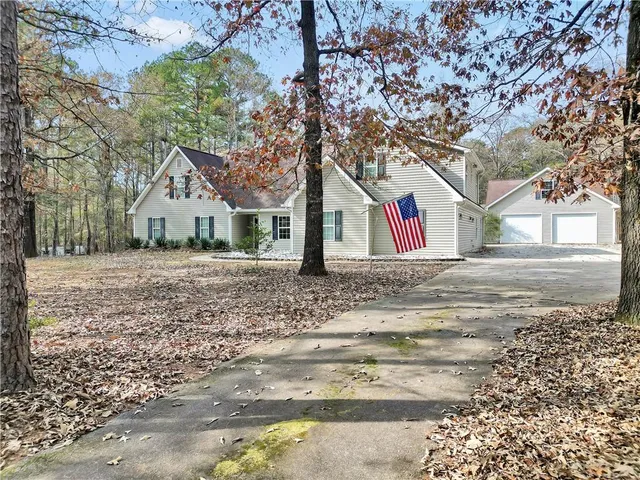 a backyard of a house with large trees