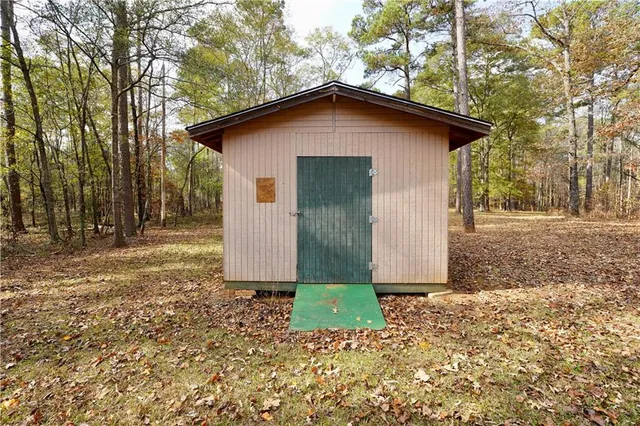 a house with trees in the background