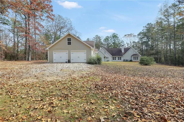 a backyard of apartments with large trees