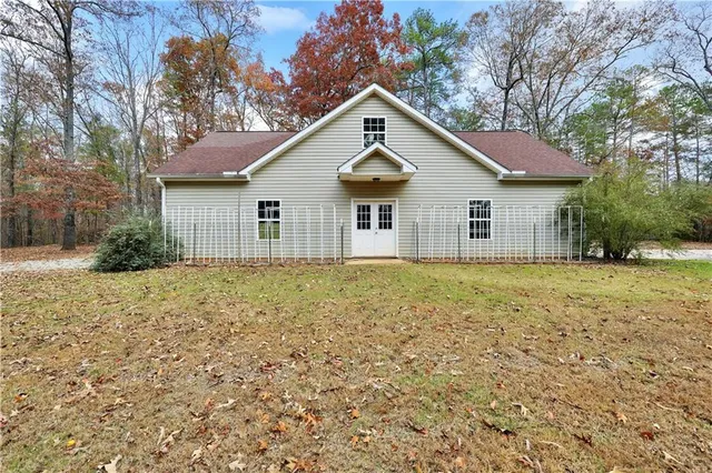 a backyard of a house with large trees