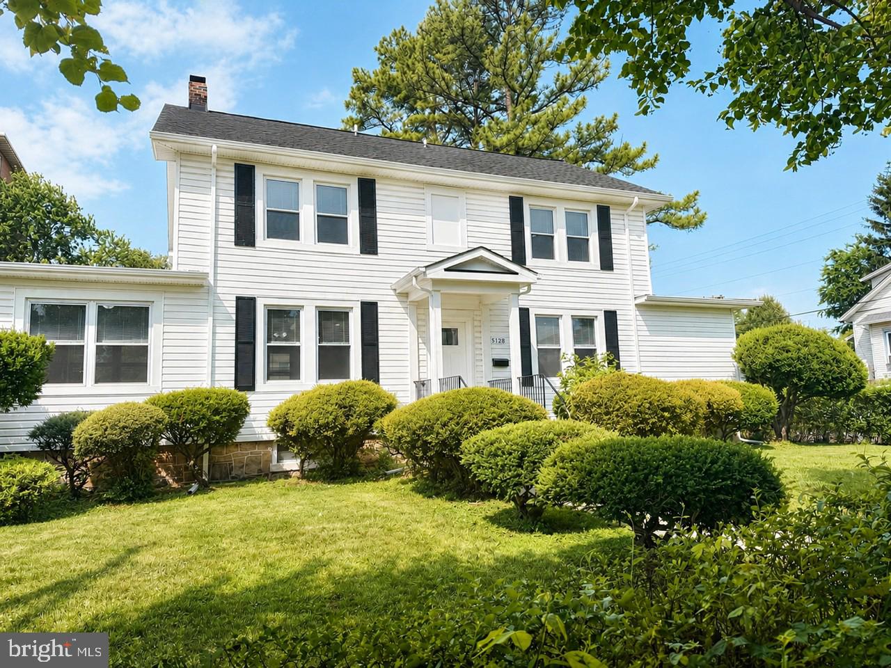 5728 Clover Road Baltimore, MD 21215 - Photo 2 of 40 a front view of a house with garden and plants