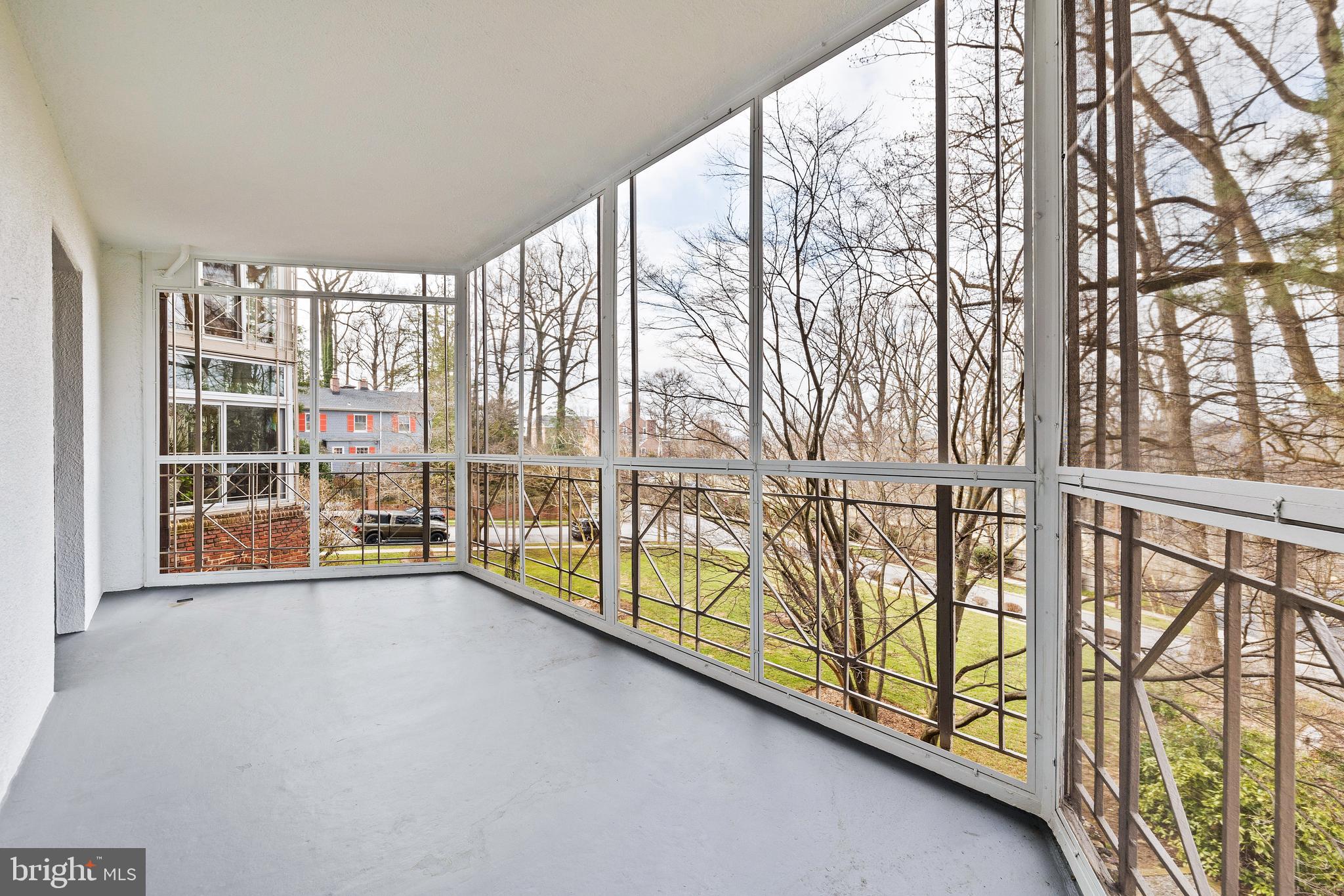 6 Upland Road, Unit B1 Baltimore, MD 21210 - Photo 17 of 39 Screened Porch with western view of lawn