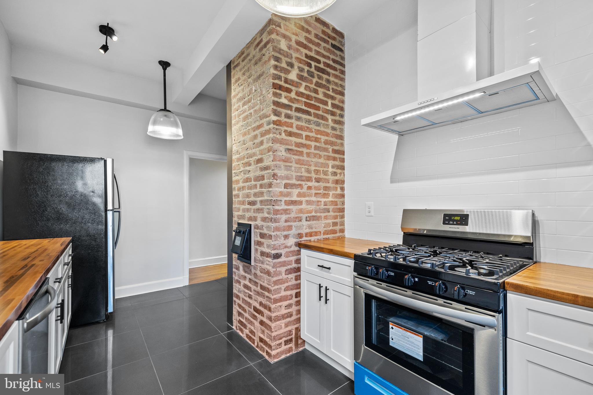 6 Upland Road, Unit B1 Baltimore, MD 21210 - Photo 25 of 39 Kitchen with exposed brick