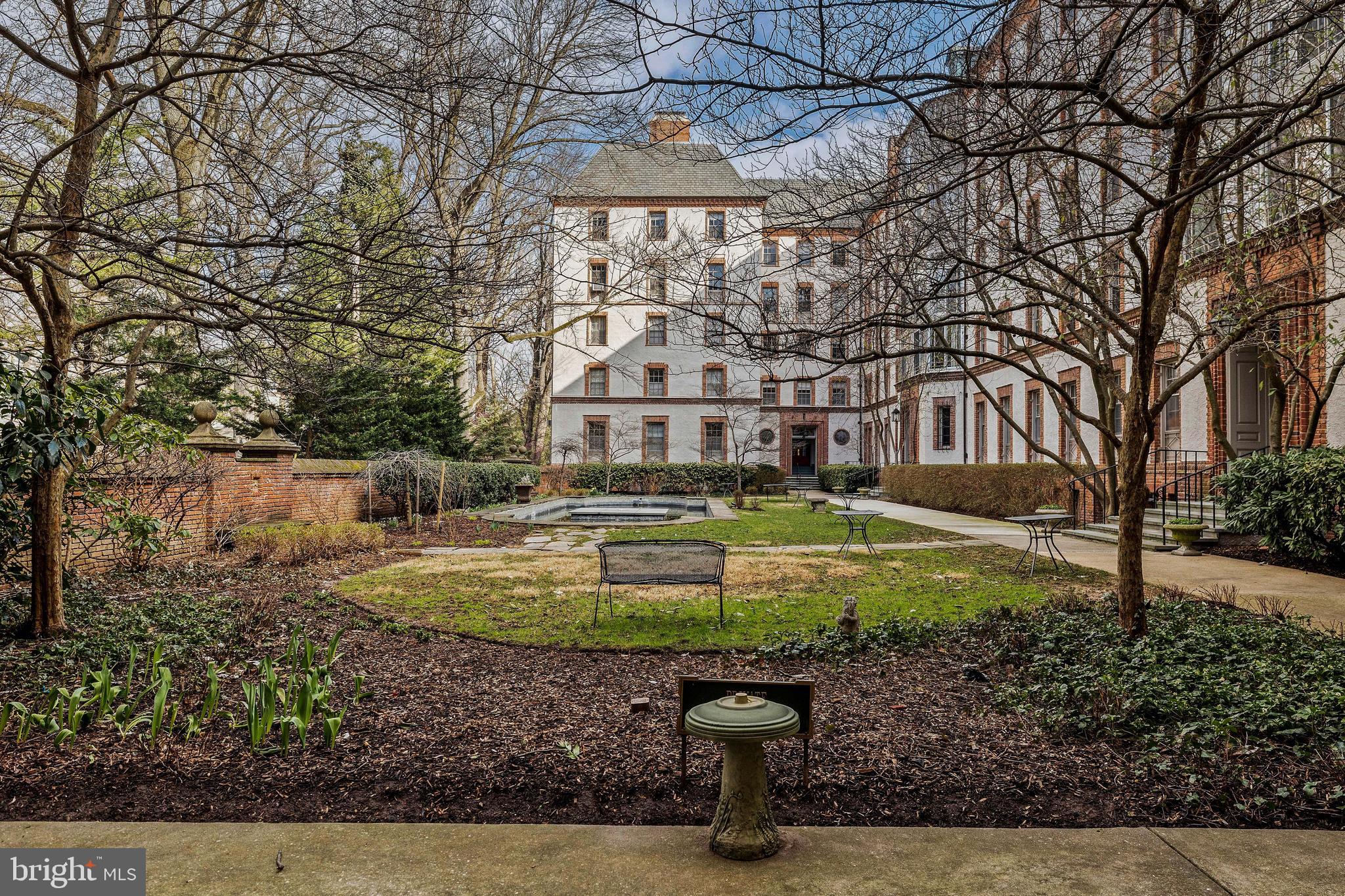 6 Upland Road, Unit B1 Baltimore, MD 21210 - Photo 8 of 39 Courtyard through archway, fish pond