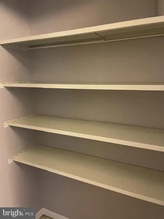 a view of room with a window and wooden floor