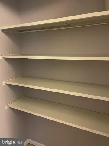 a view of room with a window and wooden floor