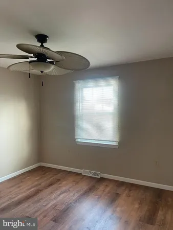 a bathroom with a shower a toilet and a shower