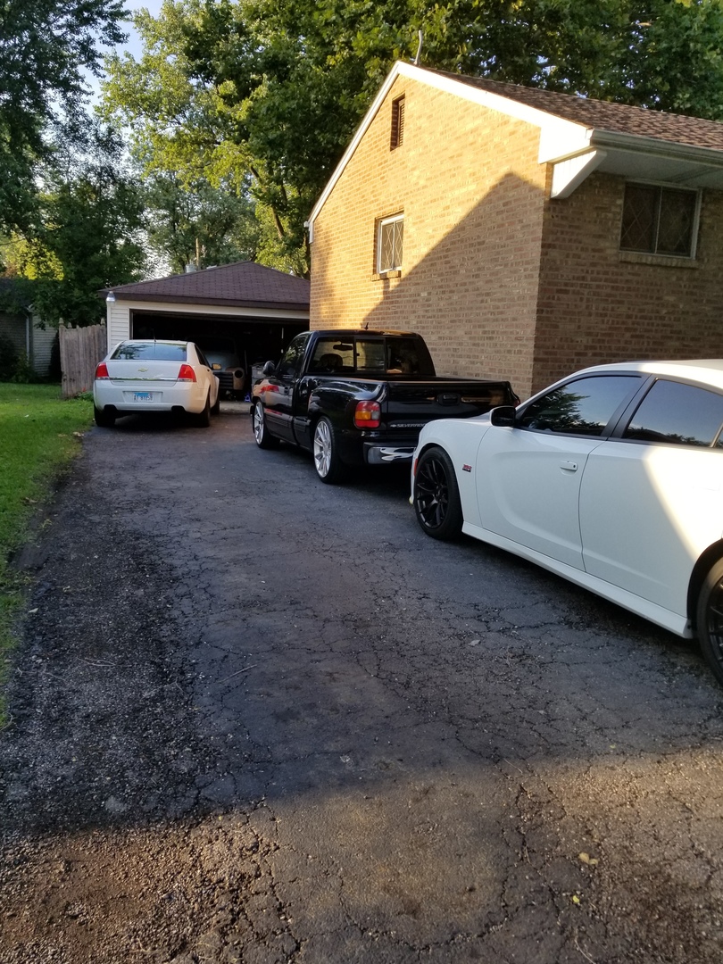 181 Oxford Road Bolingbrook, IL 60440 - Photo 3 of 29 a view of street with parked cars