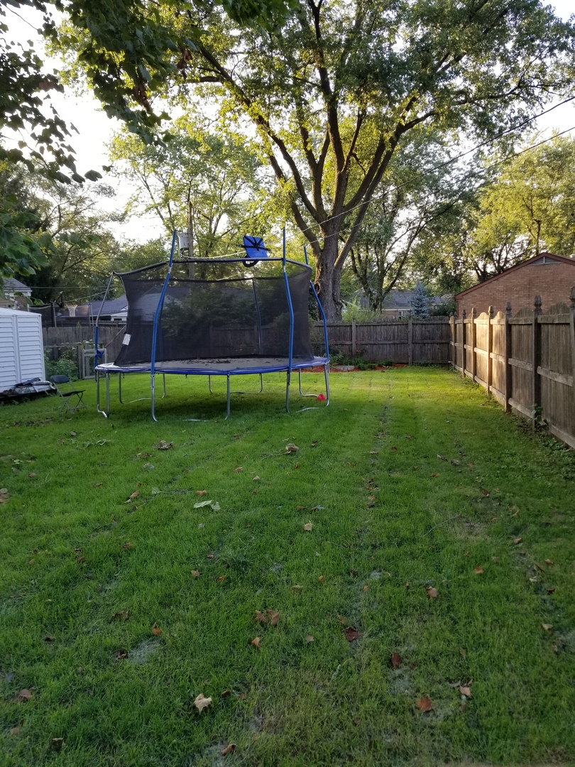 181 Oxford Road Bolingbrook, IL 60440 - Photo 5 of 29 a view of a backyard with large trees