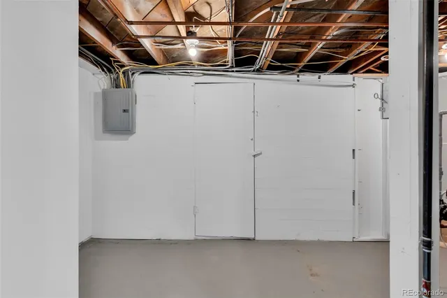 a view of storage and utility room with racks on the wall