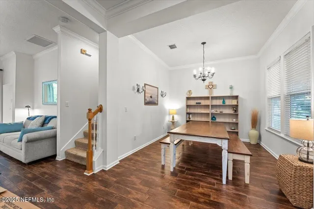 a room with furniture and a wooden floor