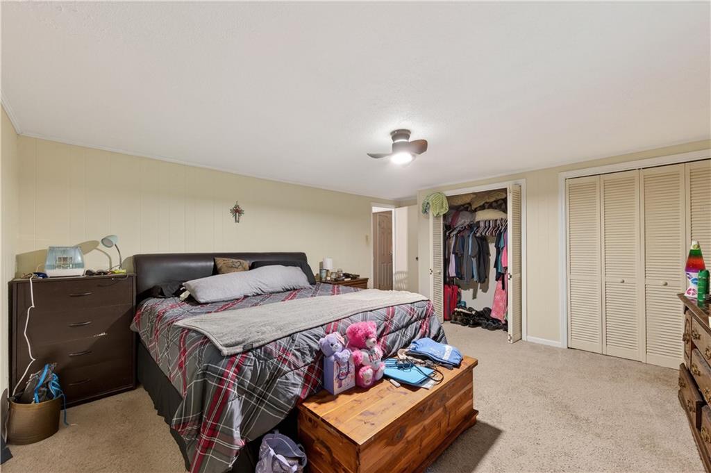 4399 Highway 411 Rydal, GA 30171 - Photo 17 of 37 a bedroom with a bed and gym equipment