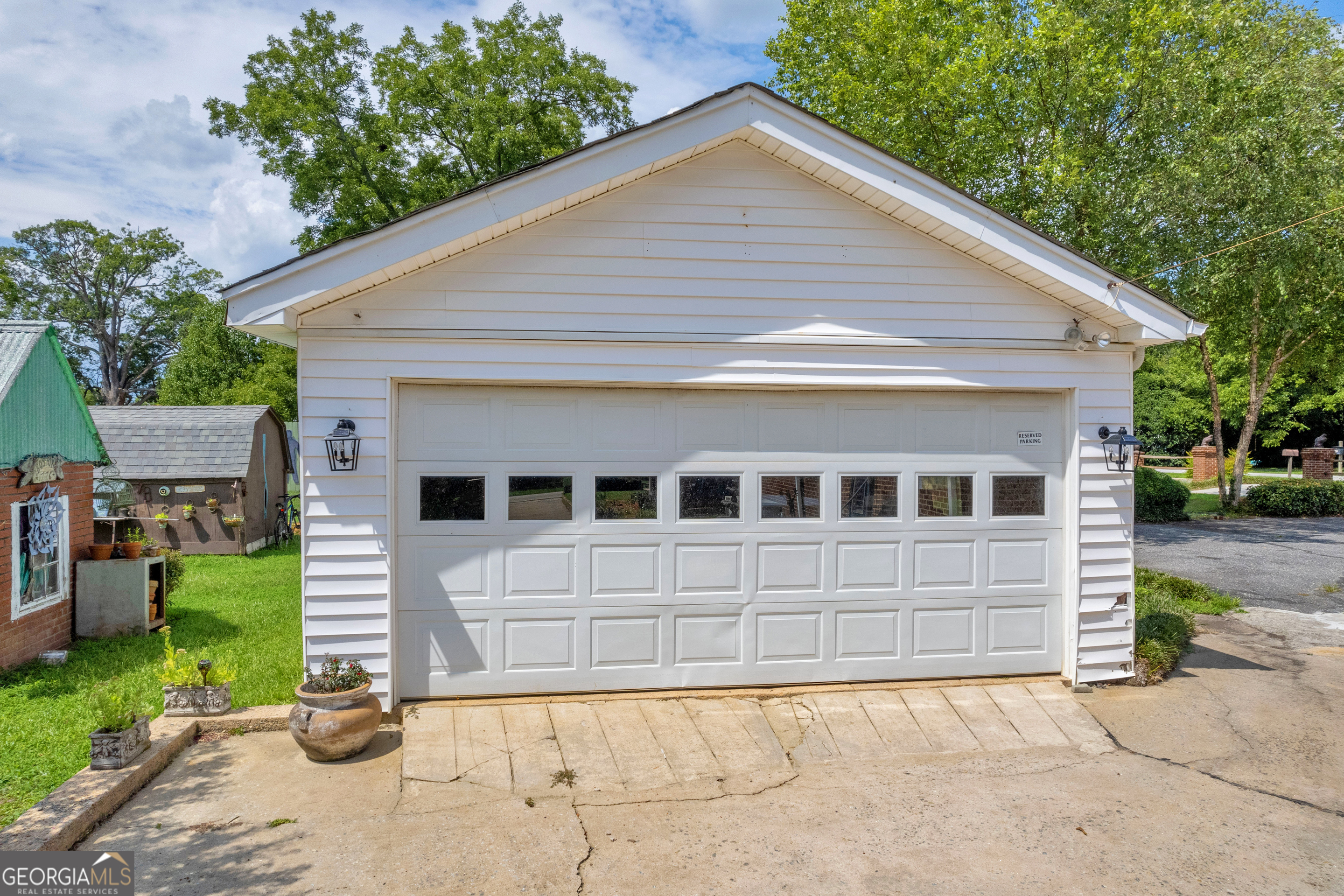 157 Hartwell Street Royston, GA 30662 - Photo 11 of 83 two car garage plus additional access door at back for storage