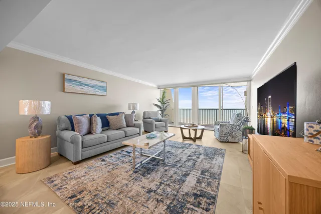 a view of a hallway with a dining table chair