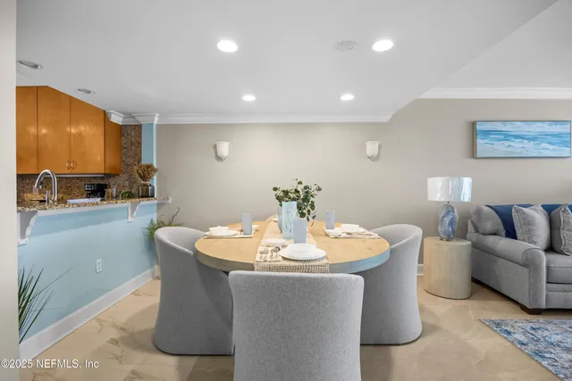 a living room with furniture wooden floor and a large window