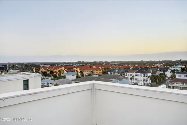 a view of a large building with a yard