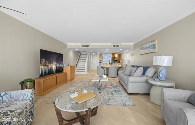 a view of a hallway with a dining table chair