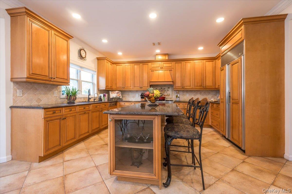 129 Round Swamp Road Huntington, NY 11743 - Photo 16 of 50 Large island with bar seating allowing for additional or casual dining.