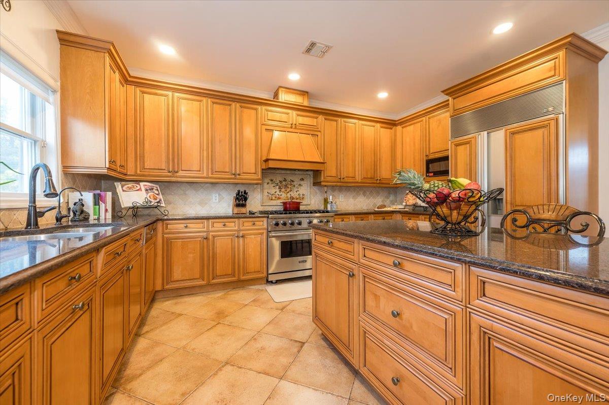129 Round Swamp Road Huntington, NY 11743 - Photo 17 of 50 High end wood cabinetry with stainless steel appliances.