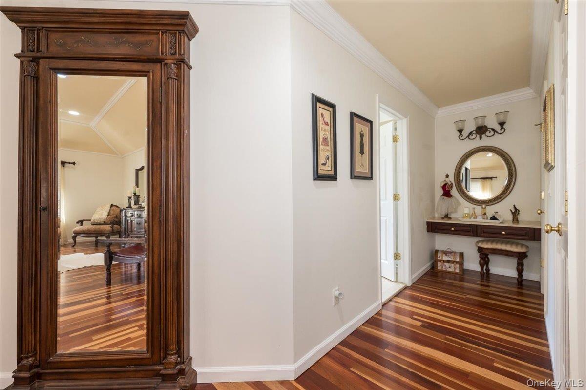 129 Round Swamp Road Huntington, NY 11743 - Photo 26 of 50 Hallway leading to walk-in closets and primary bathroom.
