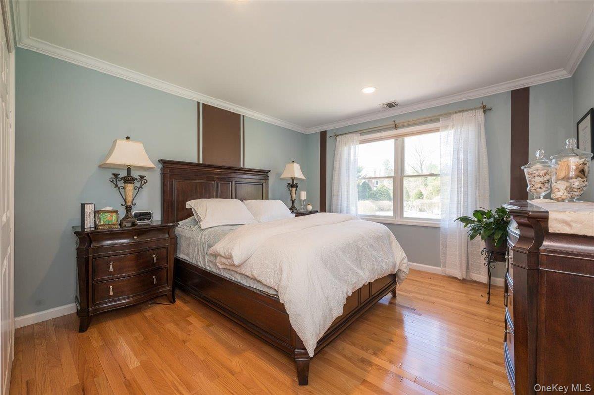 129 Round Swamp Road Huntington, NY 11743 - Photo 29 of 50 Wood flooring, crown and baseboard moldings, recessed lighting and large closet.
