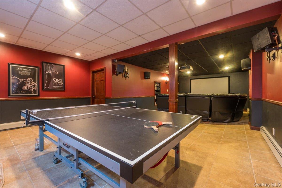 129 Round Swamp Road Huntington, NY 11743 - Photo 36 of 50 Space right off the media room with tile flooring and plenty of versatility to make the space into any mode of entertainment area.