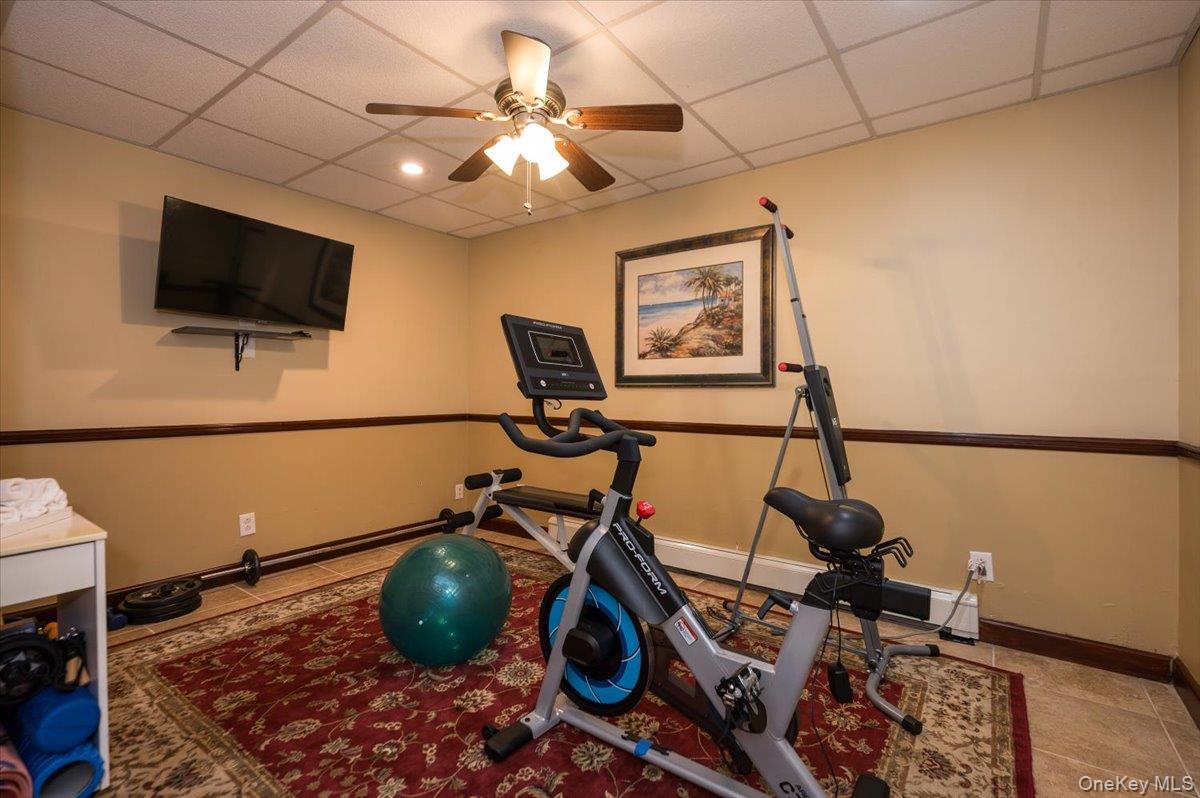 129 Round Swamp Road Huntington, NY 11743 - Photo 39 of 50 Located in the basement level. Tile flooring and decorative molding details.