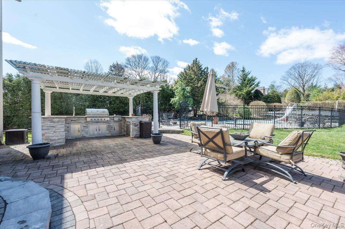 129 Round Swamp Road Huntington, NY 11743 - Photo 41 of 50 Beautiful outdoor patio with stone pavers. Plenty of space outdoor dining and lounging.