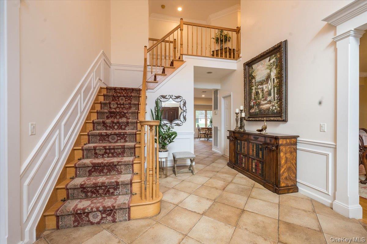 129 Round Swamp Road Huntington, NY 11743 - Photo 5 of 50 The entry foyer gives direct access to the formal dining room, formal living room, kitchen and family room.