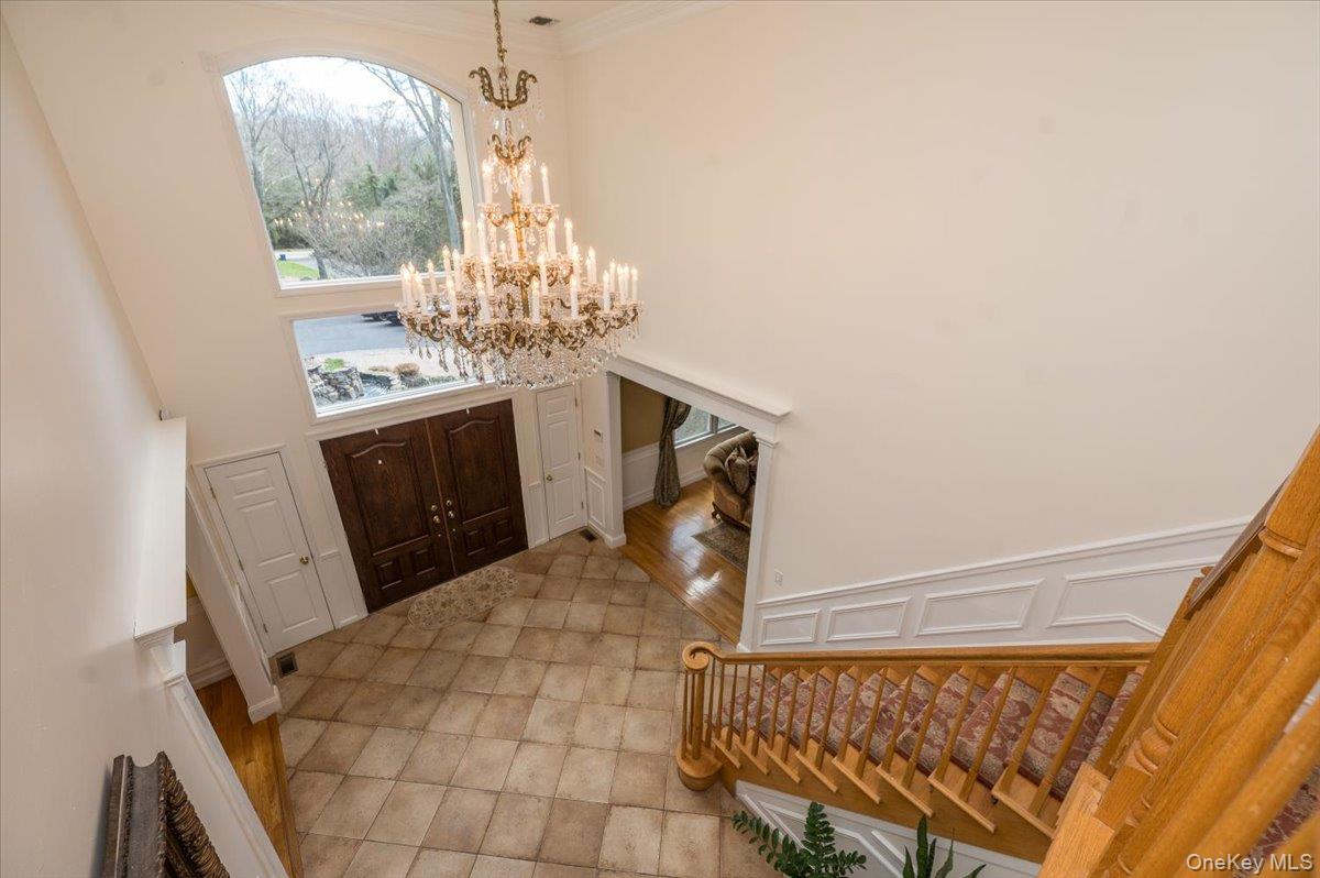 129 Round Swamp Road Huntington, NY 11743 - Photo 6 of 50 View of two-story entry foyer from the second level.