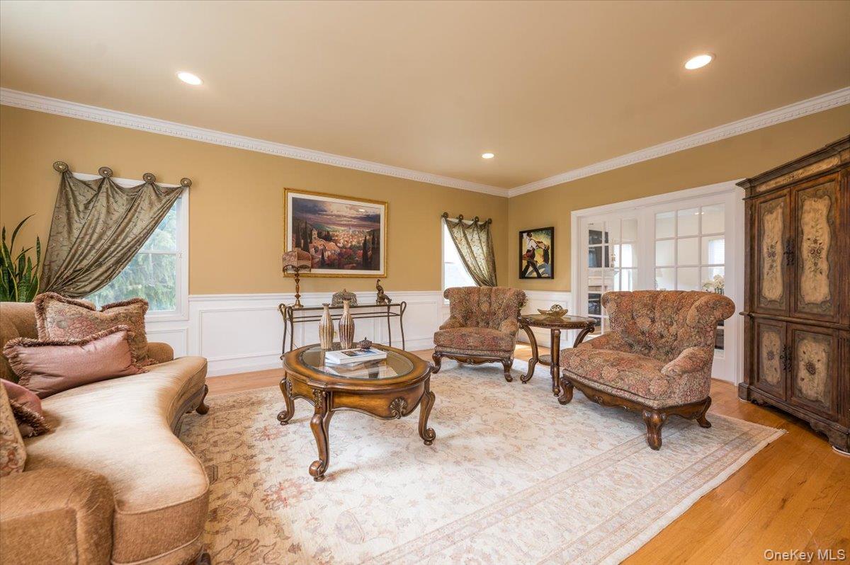 129 Round Swamp Road Huntington, NY 11743 - Photo 8 of 50 Formal living room with hardwood floors has french doors that lead to the family room.